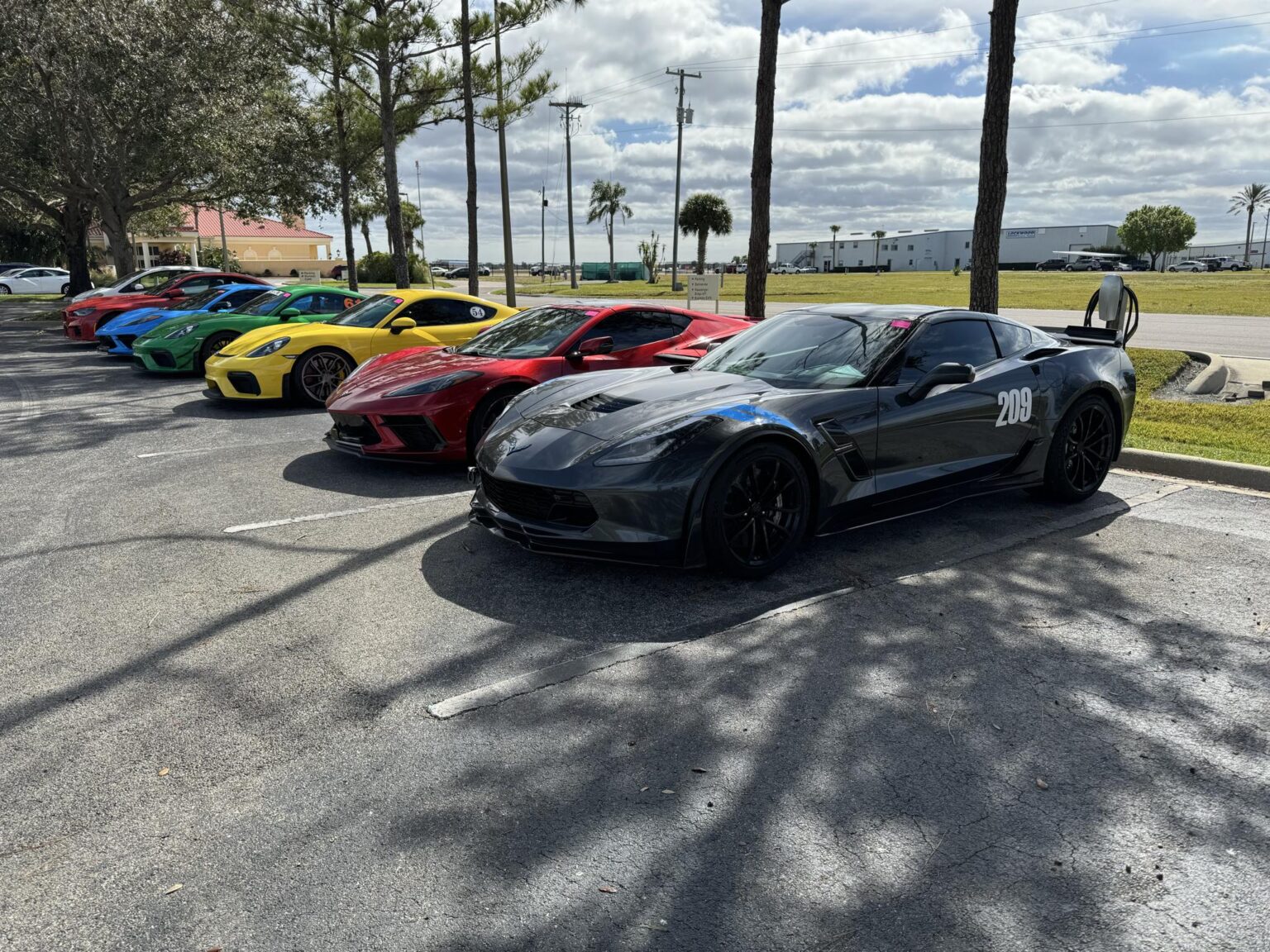 Colorful lineup of performance cars at the paddock