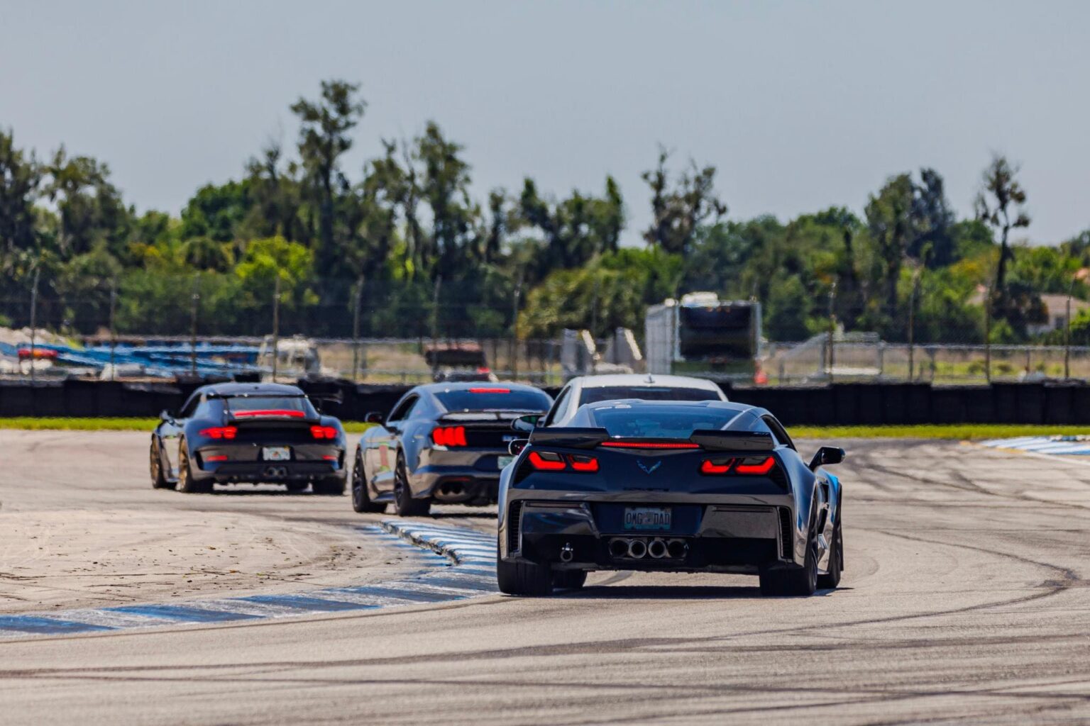 Multi-car chase through the Sebring hairpin